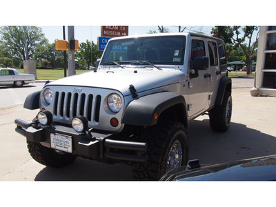 jeep wrangler unlimited 2012 silver suv sport gasoline 6 cylinders 4 wheel drive 4 speed with overdrive 76520