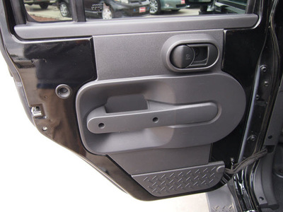 jeep wrangler unlimited 2010 black suv sport gasoline 6 cylinders 4 wheel drive manual 77388