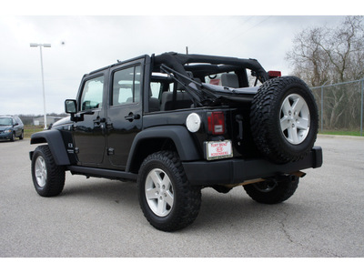 jeep wrangler unlimited 2009 black suv x gasoline 6 cylinders 4 wheel drive standard 77471