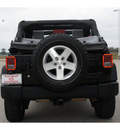 jeep wrangler unlimited 2009 black suv x gasoline 6 cylinders 4 wheel drive standard 77471