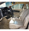 cadillac cts 2005 beige sedan sedan 6 cylinders automatic 76502