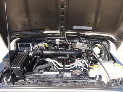 jeep wrangler 2004 beige suv x gasoline 6 cylinders 4 wheel drive automatic 76011