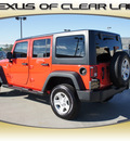 jeep wrangler unlimited 2013 red suv sport gasoline 6 cylinders 4 wheel drive automatic 77546