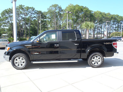 ford f 150 2011 black lariat gasoline 6 cylinders 4 wheel drive automatic 32401
