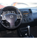 nissan versa 2010 black hatchback 1 8 sl gasoline 4 cylinders front wheel drive automatic 79119