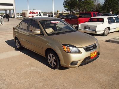 kia rio 2010 gold sedan gasoline 4 cylinders front wheel drive automatic 77375