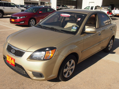 kia rio 2010 gold sedan gasoline 4 cylinders front wheel drive automatic 77375