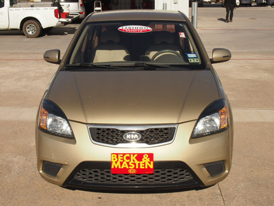 kia rio 2010 gold sedan gasoline 4 cylinders front wheel drive automatic 77375