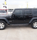 jeep wrangler unlimited 2010 black suv rubicon gasoline 6 cylinders 4 wheel drive automatic 77388
