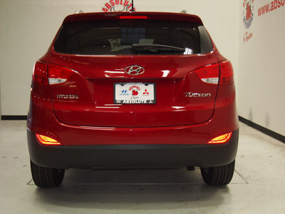 hyundai tucson 2013 dk  red gls gasoline 4 cylinders front wheel drive automatic 75150