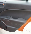 dodge caliber 2011 orange wagon mainstreet gasoline 4 cylinders front wheel drive automatic 75110
