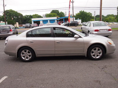 nissan altima 2002 silver sedan 2 5 s gasoline 4 cylinders front wheel drive automatic 28217