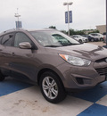 hyundai tucson 2012 brown gls gasoline 4 cylinders all whee drive automatic 77094