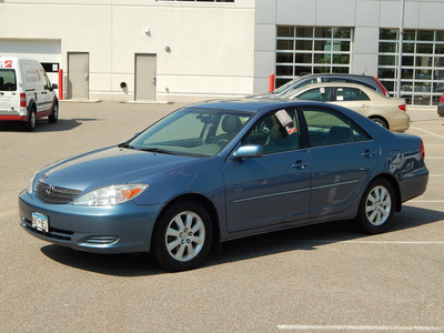 toyota camry 2002 blue sedan xle v6 gasoline 6 cylinders front wheel drive automatic with overdrive 56001