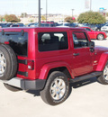 jeep wrangler 2012 red suv sahara gasoline 6 cylinders 4 wheel drive manual 76051