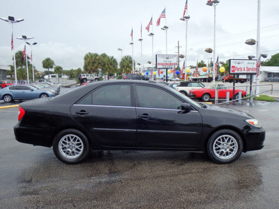 toyota camry 2002 black sedan gasoline 4 cylinders front wheel drive automatic 33021