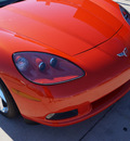 chevrolet corvette 2011 orange coupe gasoline 8 cylinders rear wheel drive 6 speed automatic 76210