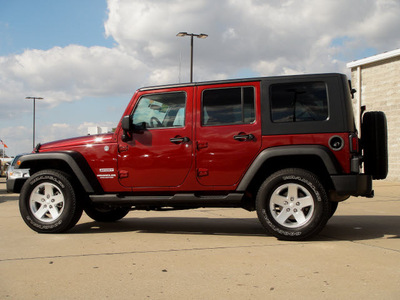 jeep wrangler unlimited 2010 red suv sport gasoline 6 cylinders 4 wheel drive automatic 62034
