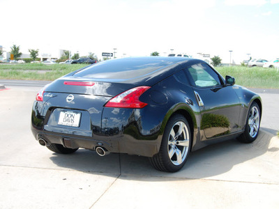 nissan 370z 2009 black coupe gasoline 6 cylinders rear wheel drive 6 speed manual 76011