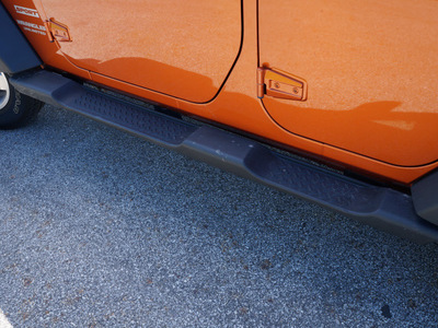 jeep wrangler unlimited 2011 orange suv sport gasoline 6 cylinders 4 wheel drive automatic 44024