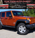 jeep wrangler unlimited 2011 orange suv sport gasoline 6 cylinders 4 wheel drive automatic 44024