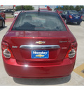 chevrolet sonic 2013 red sedan gasoline 4 cylinders front wheel drive 6 spd auto mylink touch lpo,all wthr flr mats lpo,cargo net 77090